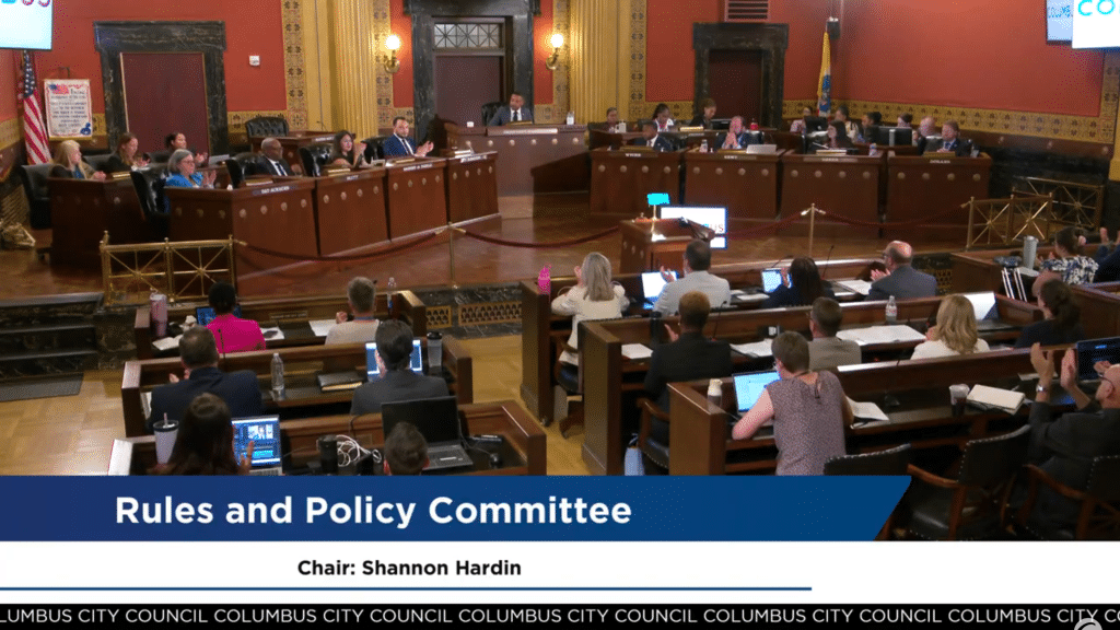 A screenshot of Columbus City Council's July 14 meeting where the room erupts into applause.