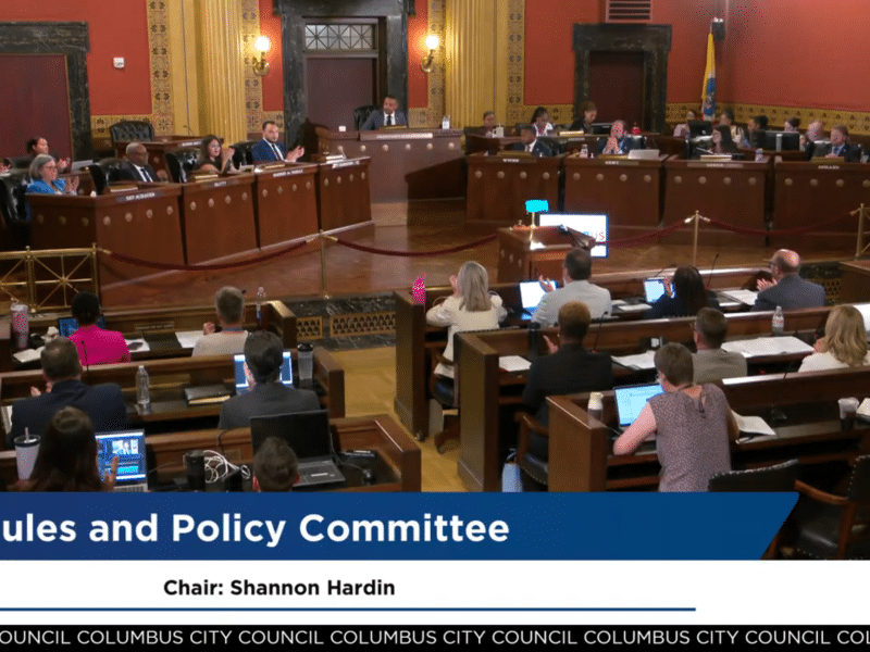 A screenshot of Columbus City Council's July 14 meeting where the room erupts into applause.