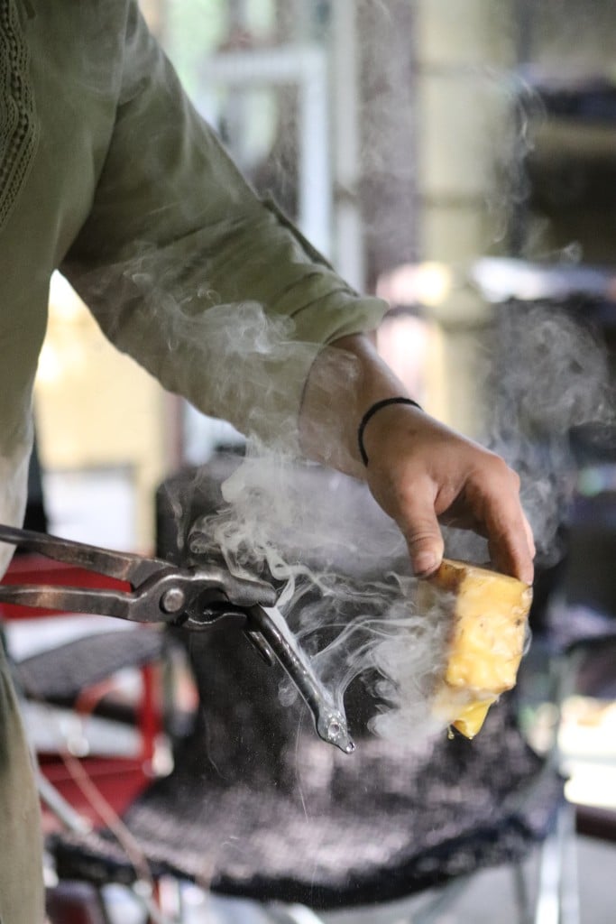 Rose Solomon, a trans blacksmith, uses a block of beeswax to prevent rust.